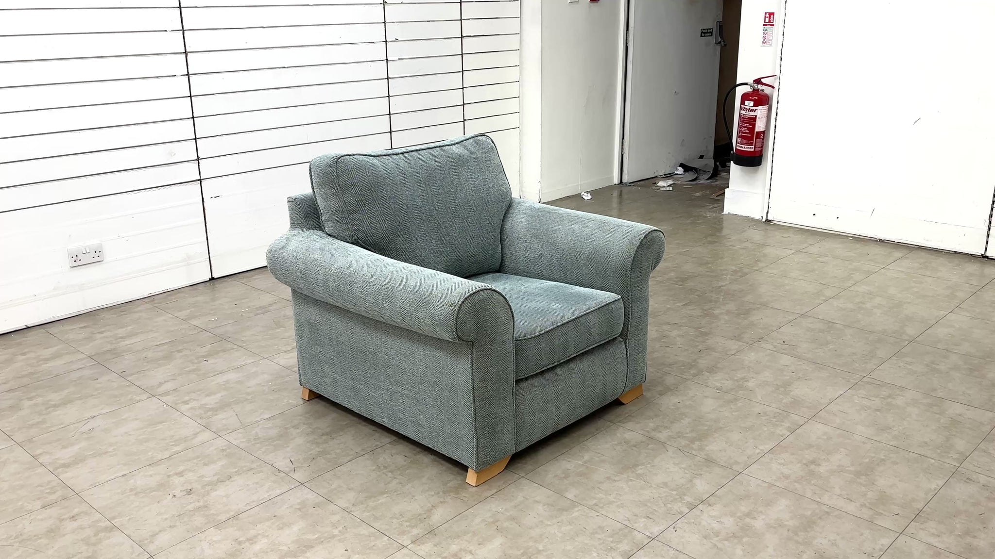 Video for the Sofology 'Ashford' armchair, which demonstrates the chair's features, size, or placement in a living room setting