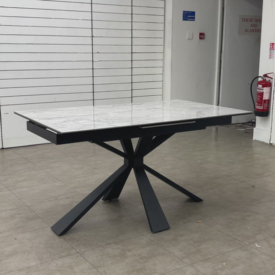 Video Of demonstration of the Crete extending dining table, showcasing the easy-to-use pop-up extension mechanism.