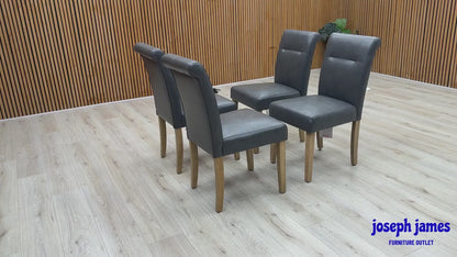‘Lewis’ Solid Oak 120cm Large Draw Leaf Extending Dining Table with Dark Grey Faux Leather Roll Back Dining Chairs - Set of 4