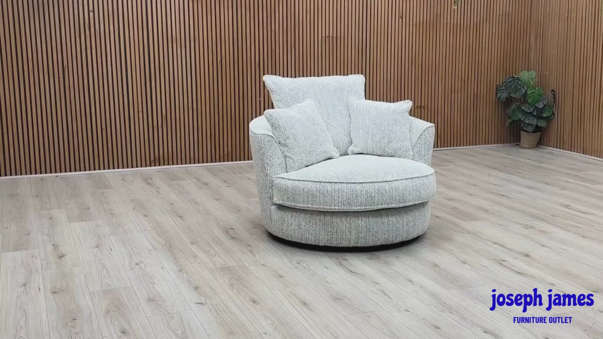 Video Of ‘Legend’ contemporary swivel armchair, beautifully upholstered in luxurious Gabriel Snow Grey fabric with a classic comfortable backrest design.