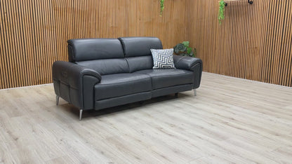 A product demonstration of the Vino Oslo 3 Seater Power Recliner Sofa in Jet Black Leather. The video highlights the smooth, independent movement of the power recliners and headrests, demonstrates the built-in USB charging, and showcases the luxurious heated seat feature designed for ultimate home comfort.