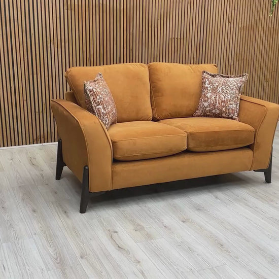 Video Of ‘Collins’ contemporary living room furniture set, featuring a 3-seater sofa and a matching 2-seater sofa, beautifully upholstered in unique Almond Orange towel velvet fabric.