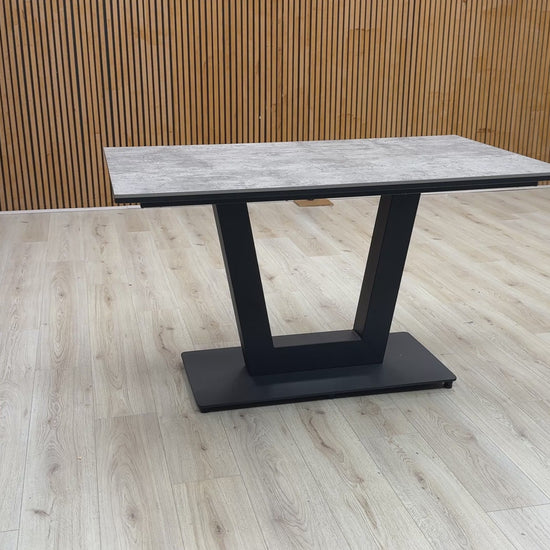 Video Of ‘Venus’ contemporary dining table, featuring a spectacular textured tabletop in a luxurious Moon finish, supported by a striking architectural base design.