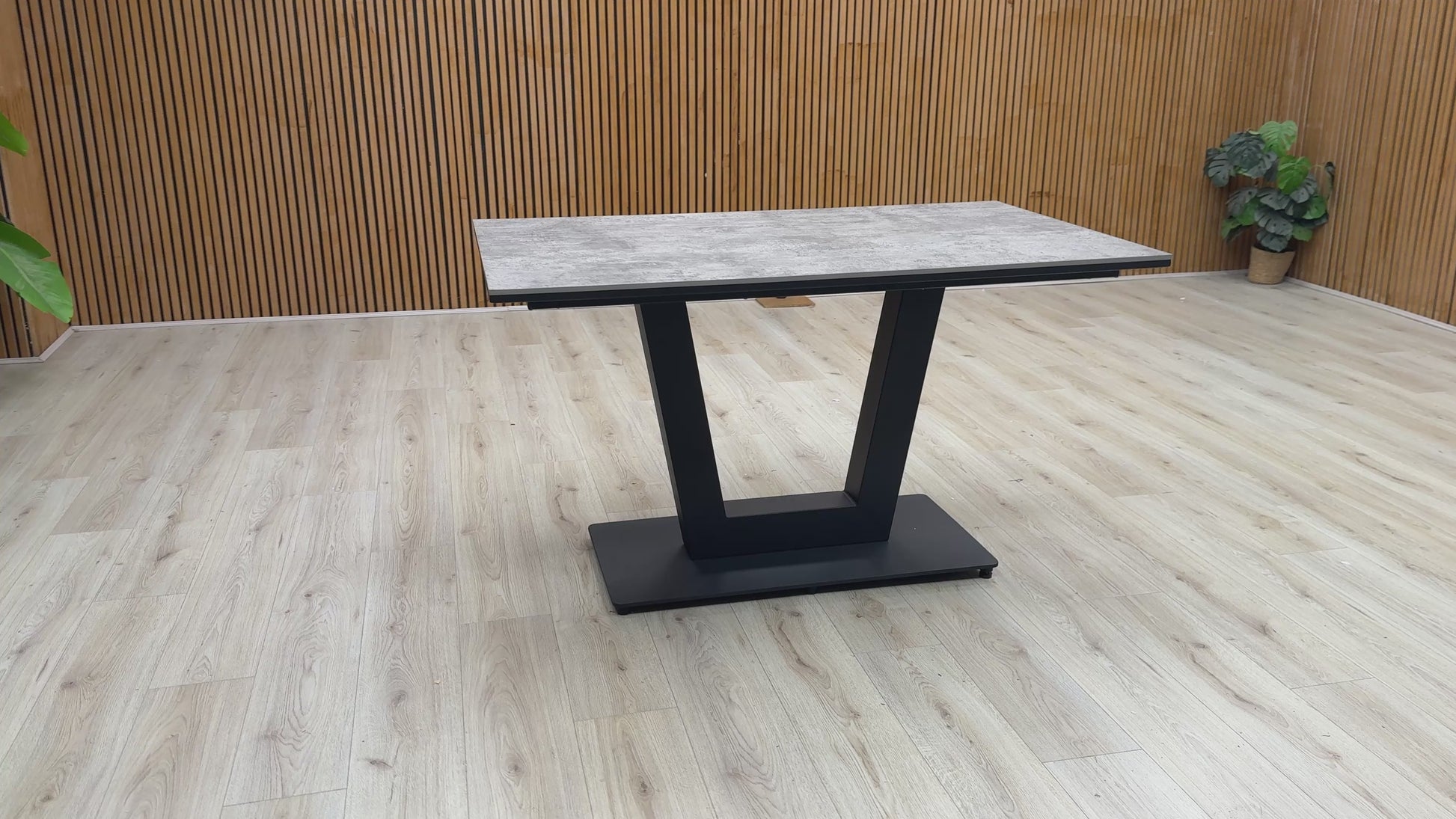 Video Of ‘Venus’ contemporary dining table, featuring a spectacular textured tabletop in a luxurious Moon finish, supported by a striking architectural base design.
