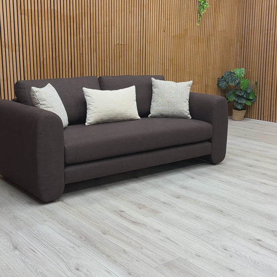A video of a chocolate brown 3 seater sofa
