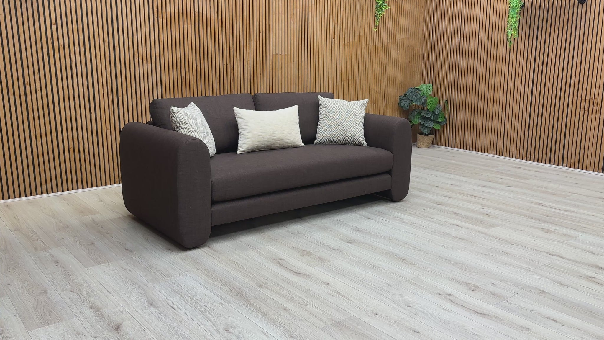 A video of a chocolate brown 3 seater sofa