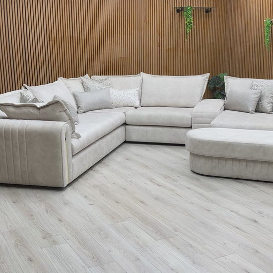 Video showing the spacious seating layout, plush velvet texture, and integrated center console of the Savoy sofa.