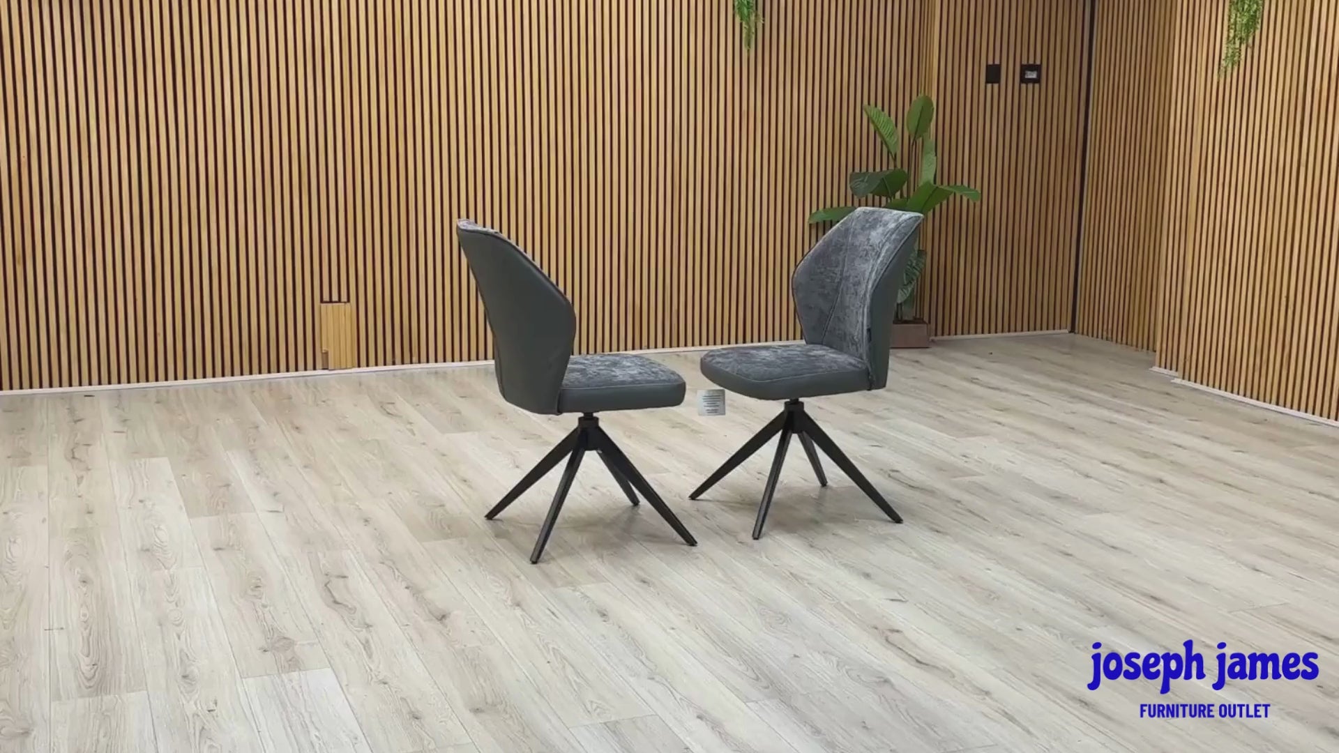 Video Of ‘Julio’ contemporary dining chairs, featuring a matching set of 2 elegantly sculpted seats upholstered in high-grade Anthracite Grey fabric with a sleek black metal base frame.