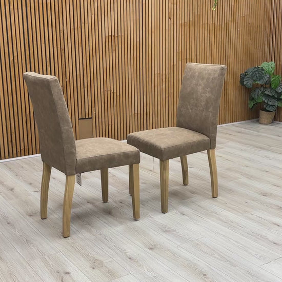 Product video tour of the Furnitureland ‘Augusta’ Taupe Cowboy Upholstered Dining Chairs, demonstrating the fabric’s unique texture, the resilience of the seat padding, and overall structural stability.
