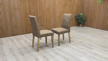 Product video tour of the Furnitureland ‘Augusta’ Taupe Cowboy Upholstered Dining Chairs, demonstrating the fabric’s unique texture, the resilience of the seat padding, and overall structural stability.