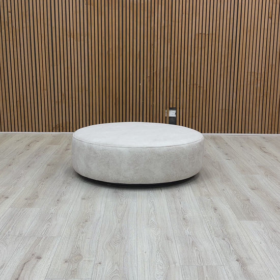 Video of swivel function and structure of the Mariah Dapple Cream Velvet Round Twister Footstool