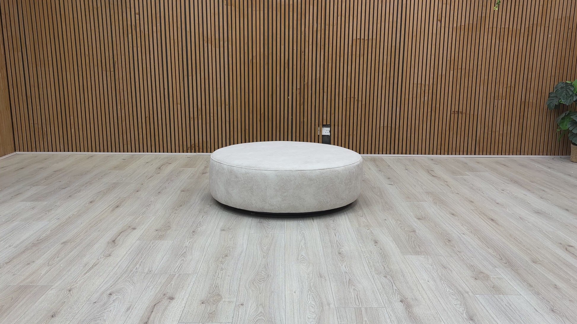 Video of swivel function and structure of the Mariah Dapple Cream Velvet Round Twister Footstool