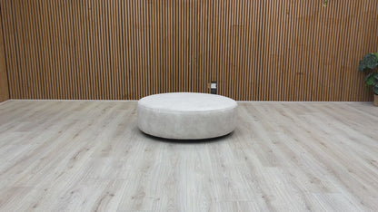Video of swivel function and structure of the Mariah Dapple Cream Velvet Round Twister Footstool
