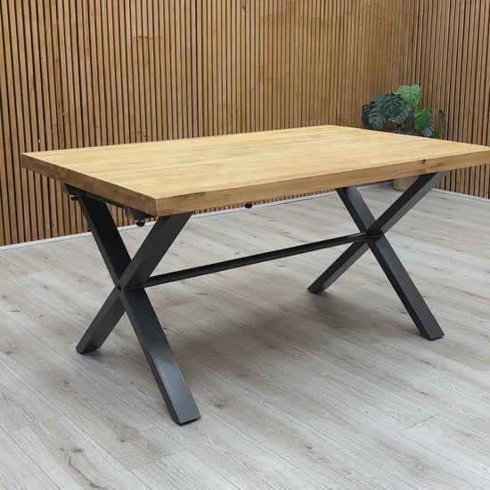 Product video tour of the Furniture Village ‘Earth’ Solid Oak 150cm Fixed Dining Table, demonstrating the rustic oiled finish texture, structural stability, and surface thickness.