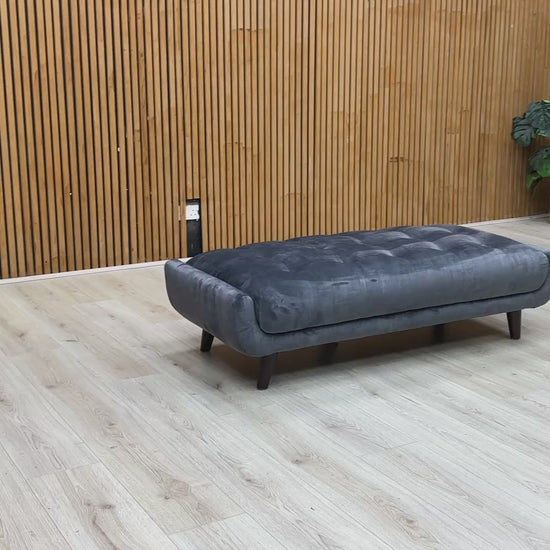 Video  lifestyle view of a velvet footstool.