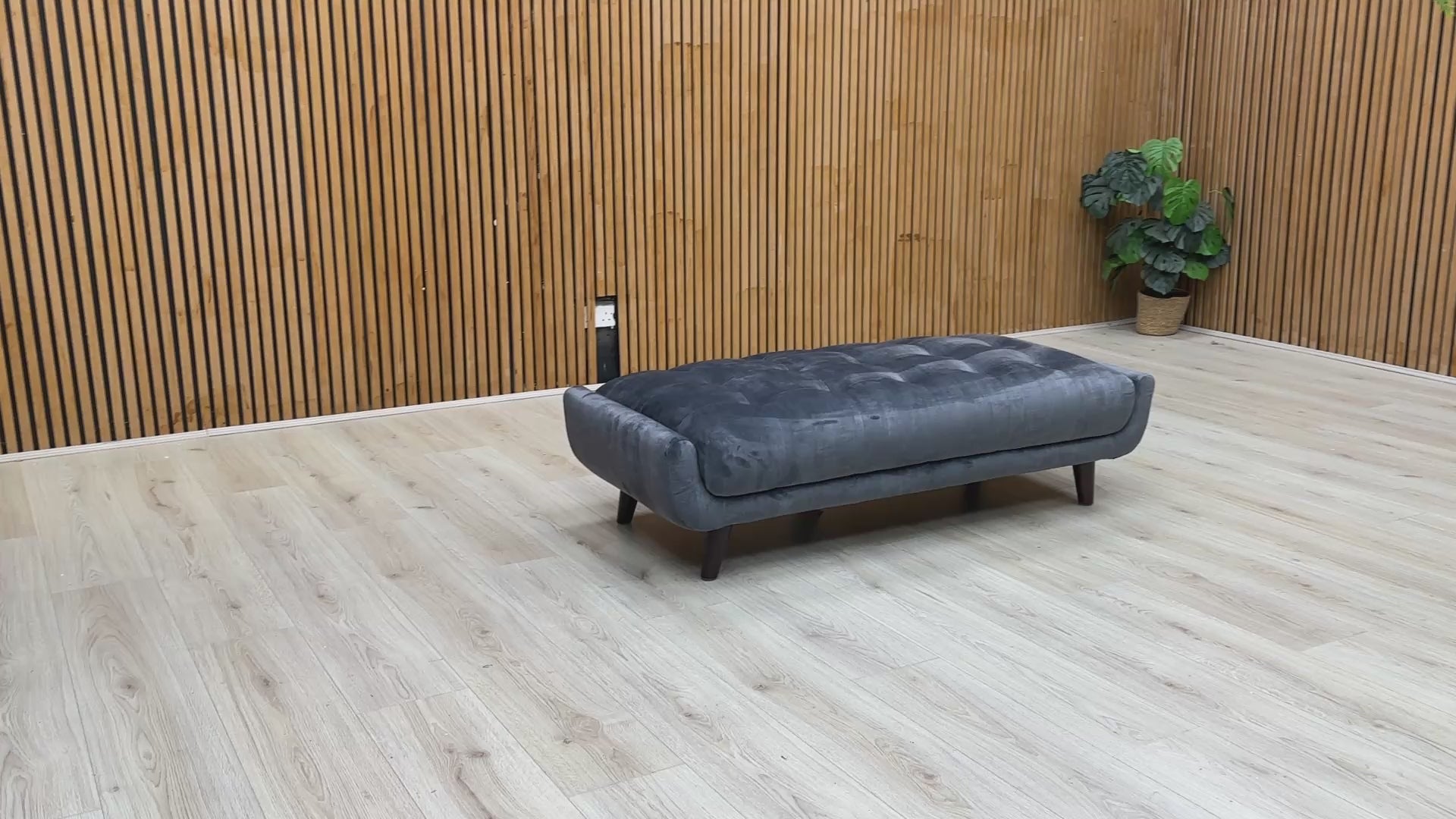 Video  lifestyle view of a velvet footstool.