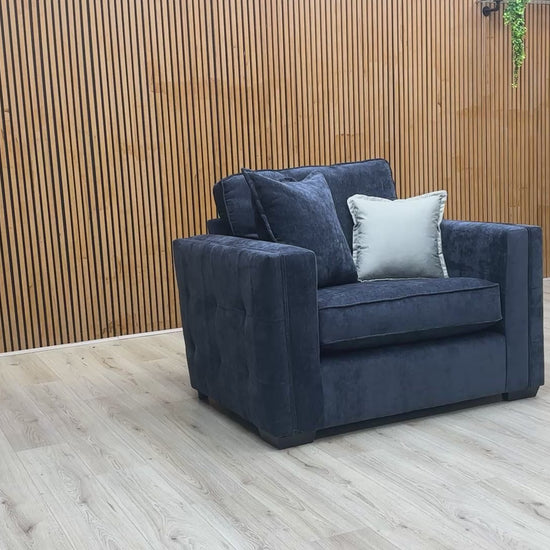 Product video showing the Chelsea love chair from various angles, emphasizing the fabric texture and build quality.
