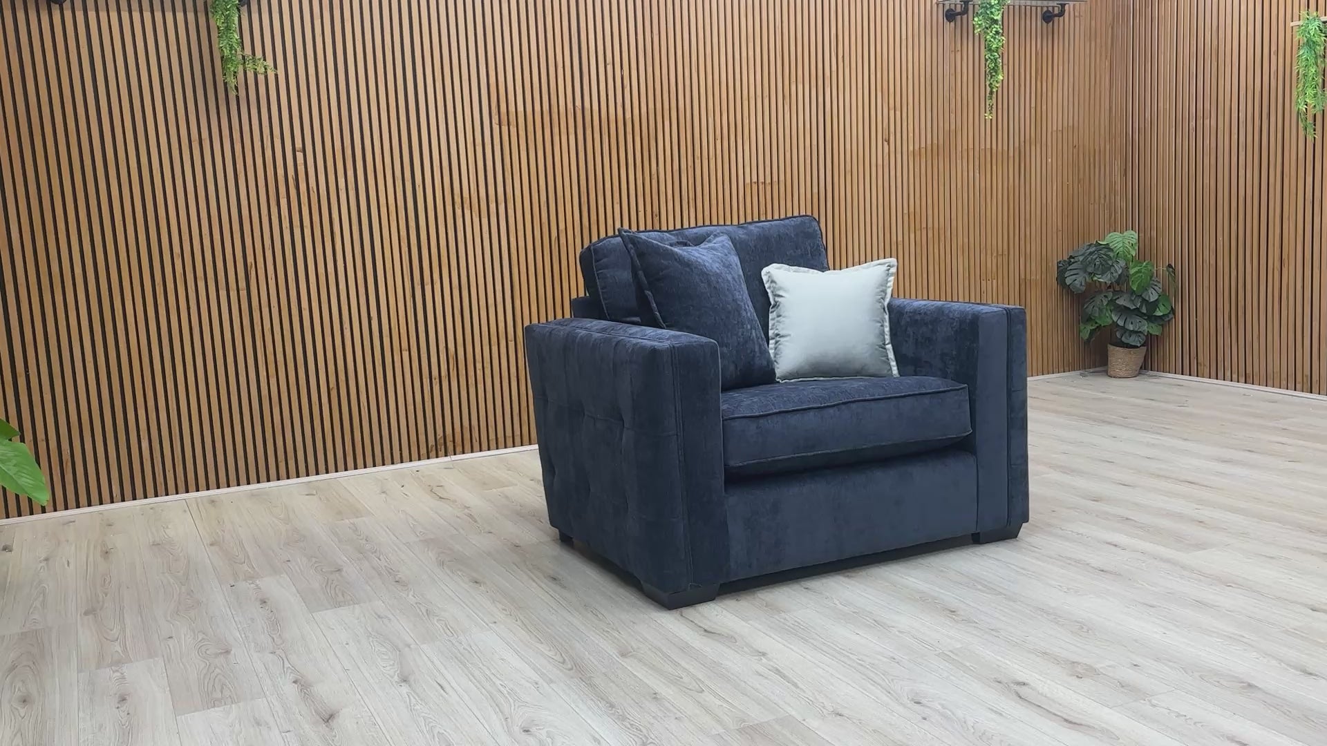 Product video showing the Chelsea love chair from various angles, emphasizing the fabric texture and build quality.