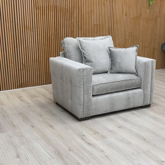 Product tour of the Chelsea cuddler chair, featuring the textured soft weave fabric and demonstrating the comfort of the foam-filled cushions.