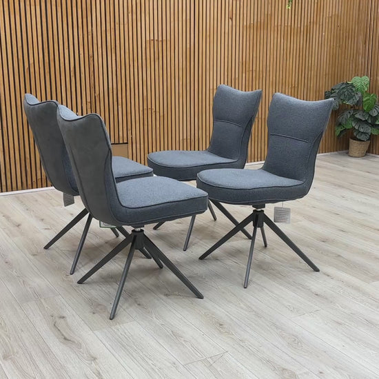 Product video tour of the ‘Carrera’ Grey Fabric Swivel Dining Chairs, demonstrating the smooth auto-return swivel mechanism, fabric durability, and overall structural stability.