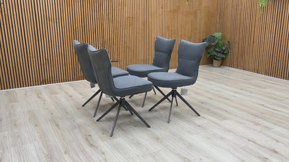 Product video tour of the ‘Carrera’ Grey Fabric Swivel Dining Chairs, demonstrating the smooth auto-return swivel mechanism, fabric durability, and overall structural stability.