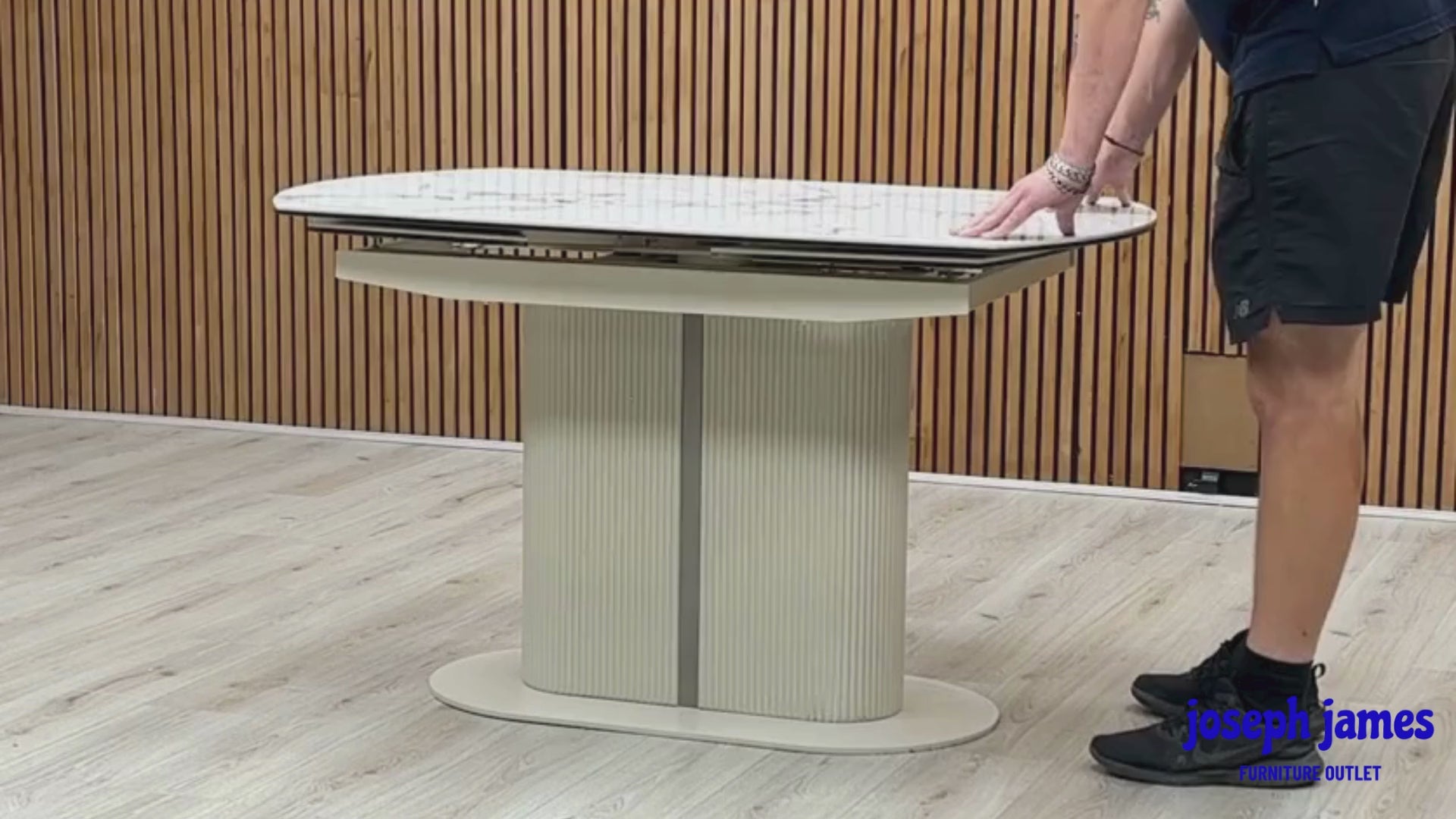Video demonstration showing the unique swivel action transformation of the Avorio white ceramic dining table. Short clip highlights how a smooth 180-degree twist opens the hidden extension panels automatically.
