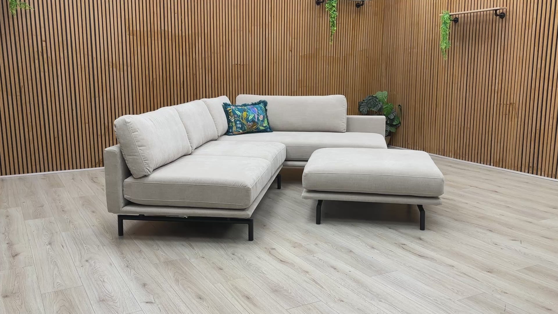 Product walk-around of the Brixton Taupe Fabric Corner Chaise, demonstrating the fabric texture, seat firmness, and footstool versatility.