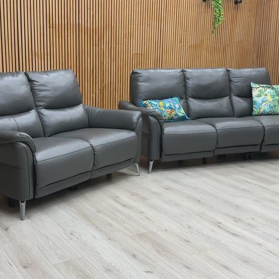 A demonstration of the effortless power reclining feature on the 'Daytona' sofa set.