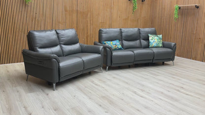 A demonstration of the effortless power reclining feature on the 'Daytona' sofa set.