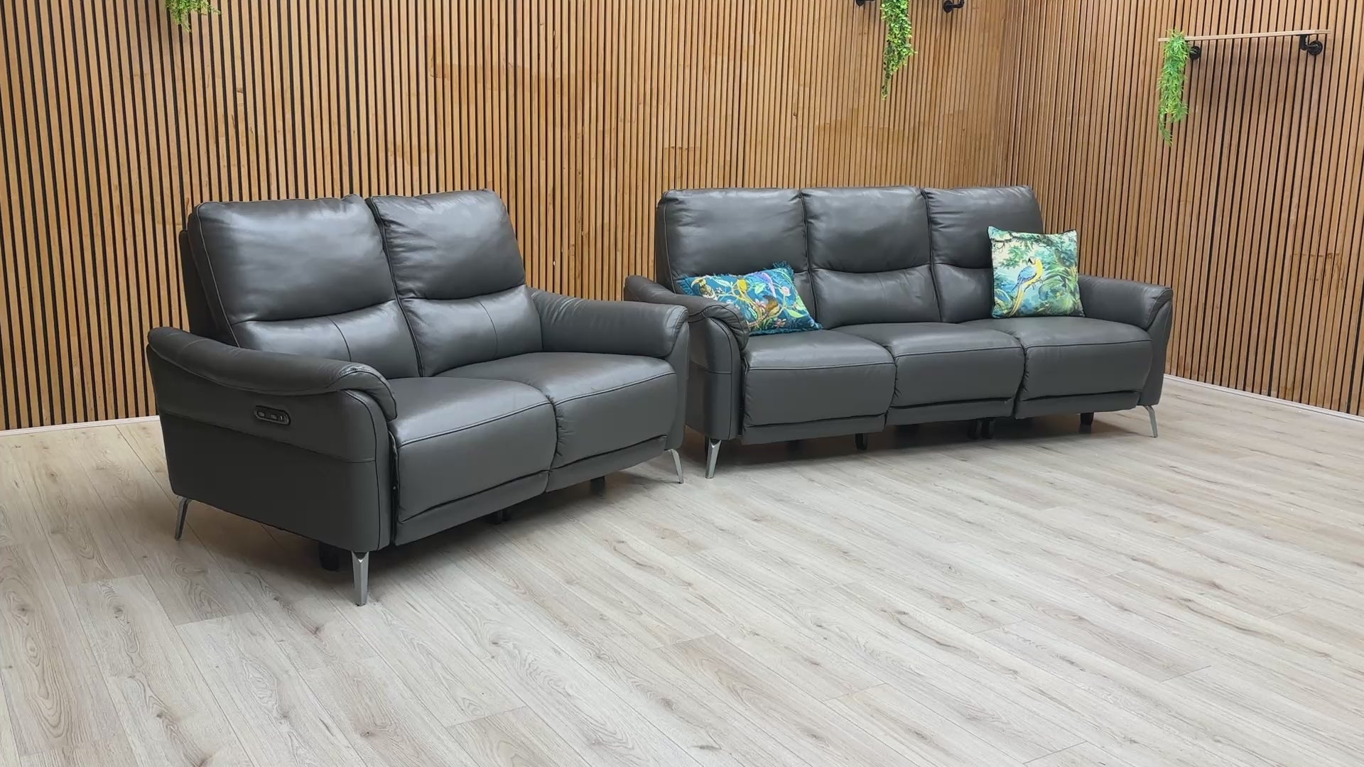 A demonstration of the effortless power reclining feature on the 'Daytona' sofa set.