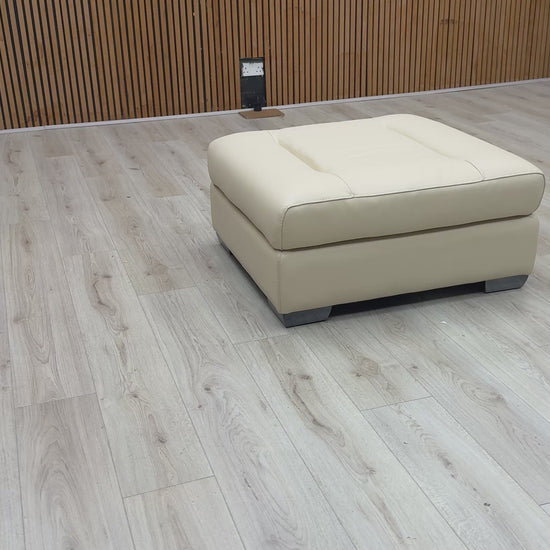 Video Of ‘Action’ contemporary large square footstool, beautifully upholstered in a sophisticated Taupe leather with a clean, modern aesthetic.