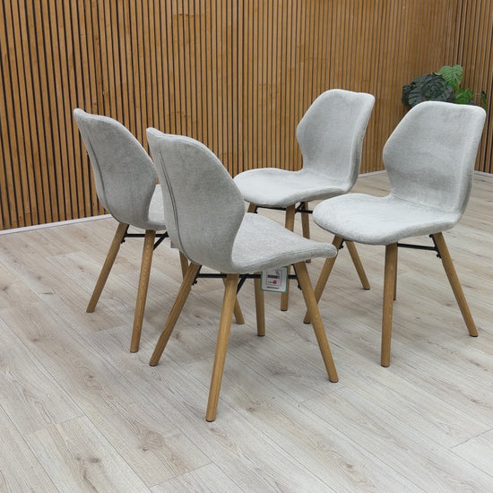 Product video tour of the ‘Stockholm’ upholstered dining chairs, demonstrating the fabric texture, foam cushioning comfort, and overall build quality.
