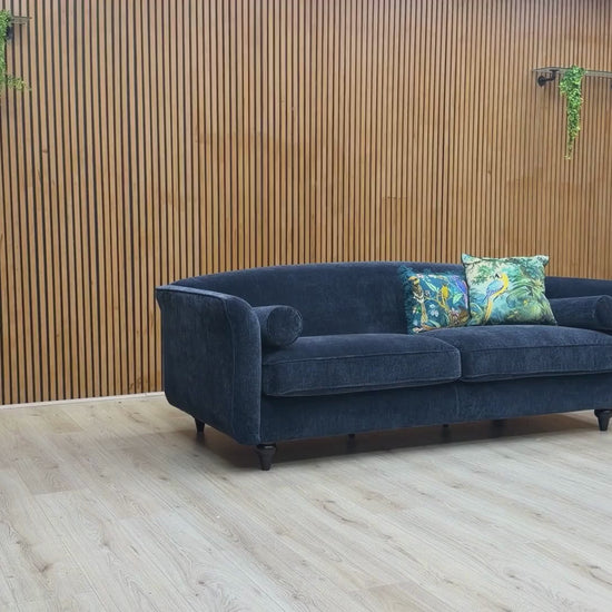 Video Of ‘Dame’ contemporary 4 and 4-seater sofa set, beautifully upholstered in high-grade Navy Blue Dame Plain fabric, featuring a complete matching pair of extra-wide lounge sofas with coordinating cylindrical bolster cushions.