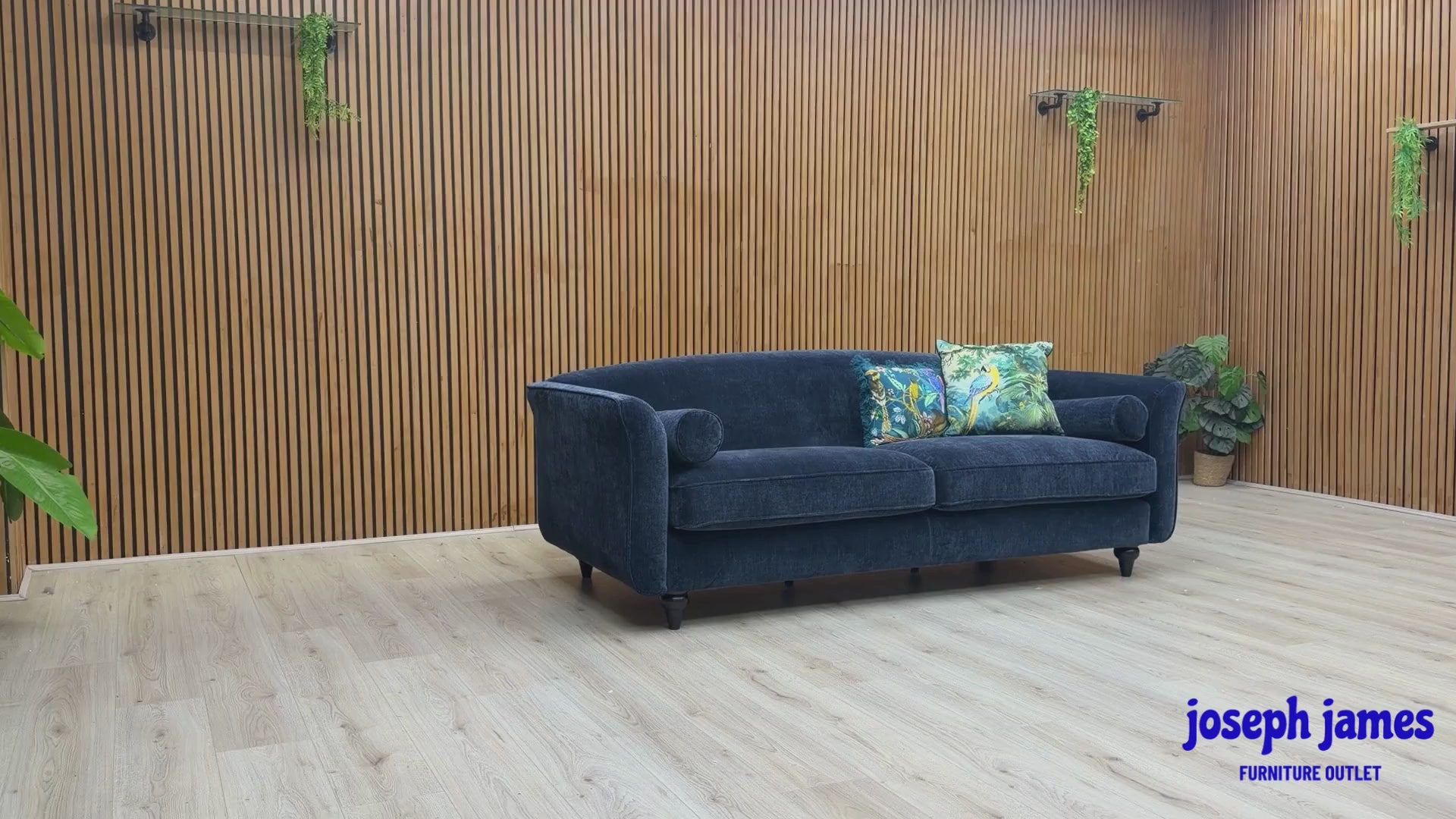 Video Of ‘Dame’ contemporary 4 and 4-seater sofa set, beautifully upholstered in high-grade Navy Blue Dame Plain fabric, featuring a complete matching pair of extra-wide lounge sofas with coordinating cylindrical bolster cushions.