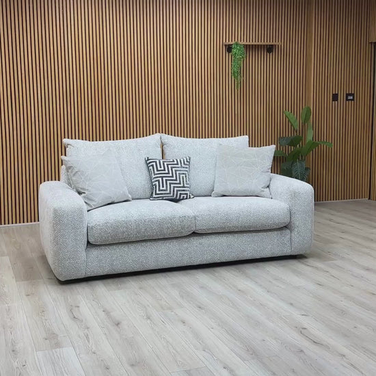 Video Of ‘Pandora’ contemporary living room suite, showcasing a luxury 3-seater sofa beautifully upholstered in a stylish Chevron Silver fabric with elegant structural lines.