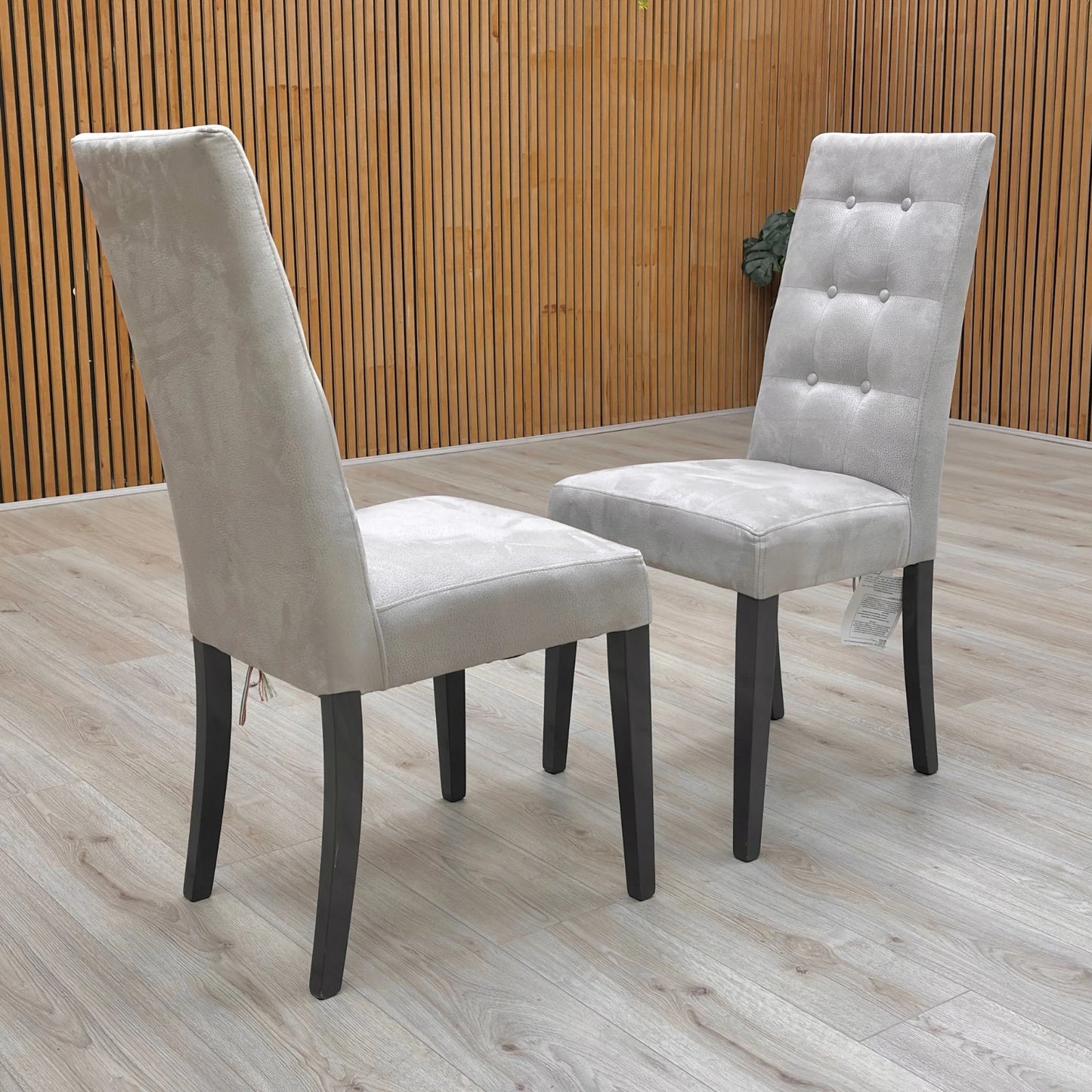 Lifestyle view of the Mia High Back Dining Chair, showing its slim profile, depth, and the height of the backrest