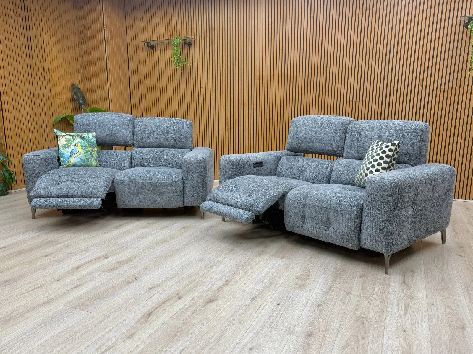 Lifestyle photo showing the 2+2 sofa set arranged together in a modern living room setting.