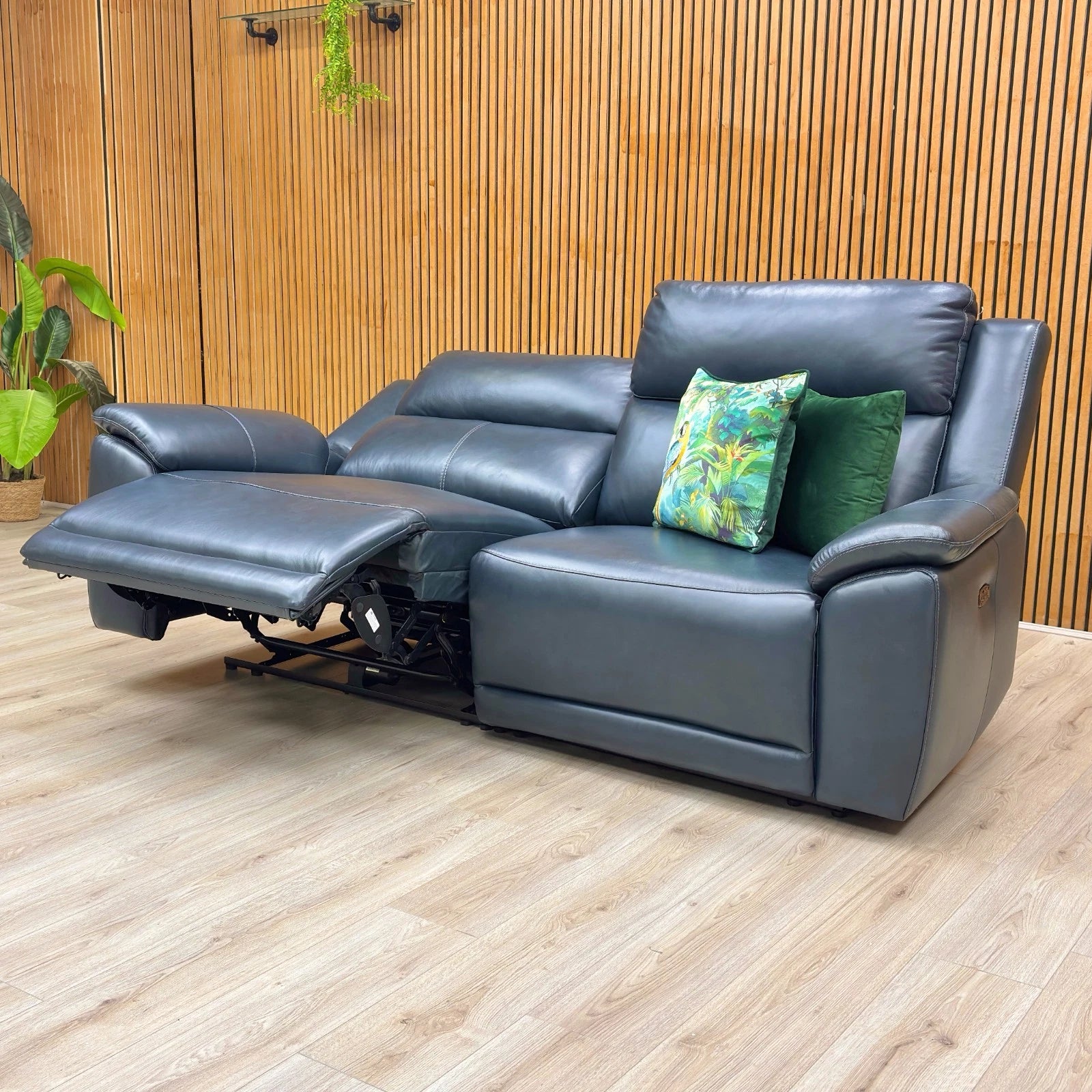 Lifestyle view of the 3-seater power recliner in a home setting, showing its deep navy color and comfortable, upright seating design.