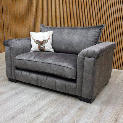 Side view of the cuddler, showing the depth and the high backrest.