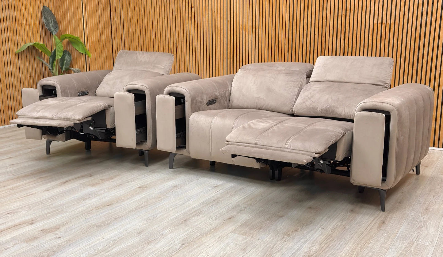 Lifestyle shot of the Cedar Velvet 2-seater sofa and armchair in a modern living room, showcasing the rich green fabric and sleek metal legs.