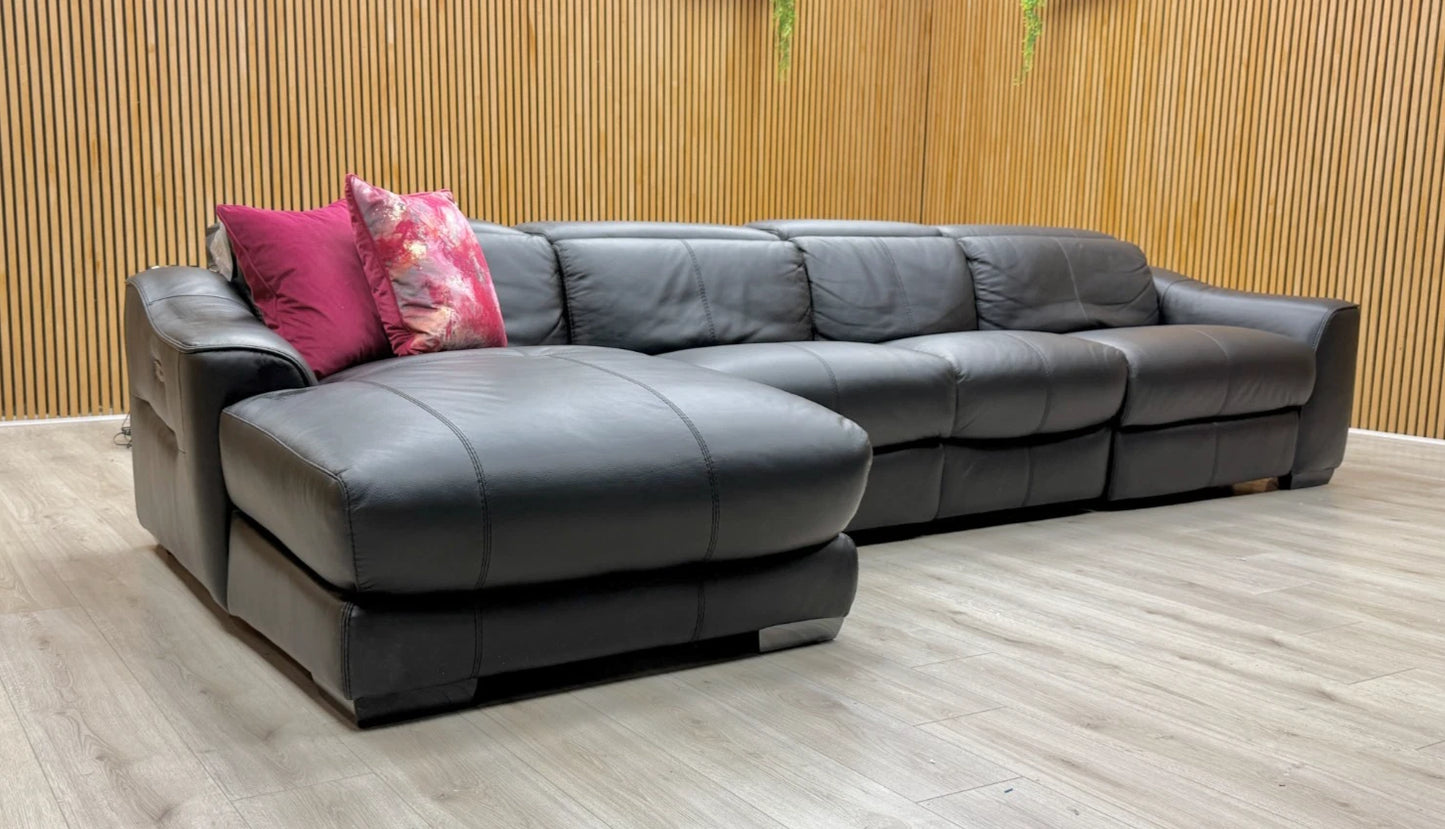 Lifestyle view of the Xavier black leather chaise sofa highlighting the left-hand facing chaise and contemporary modular design.