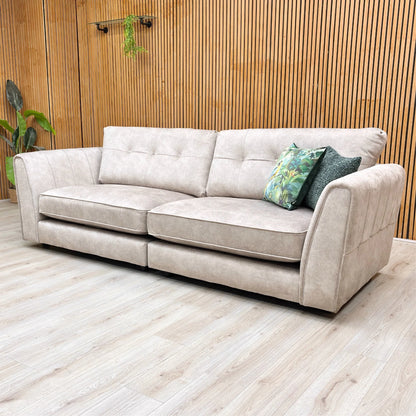 Lifestyle shot of the Mariah Dapple Cream sofa, highlighting the deep, roomy seating and classic back design.