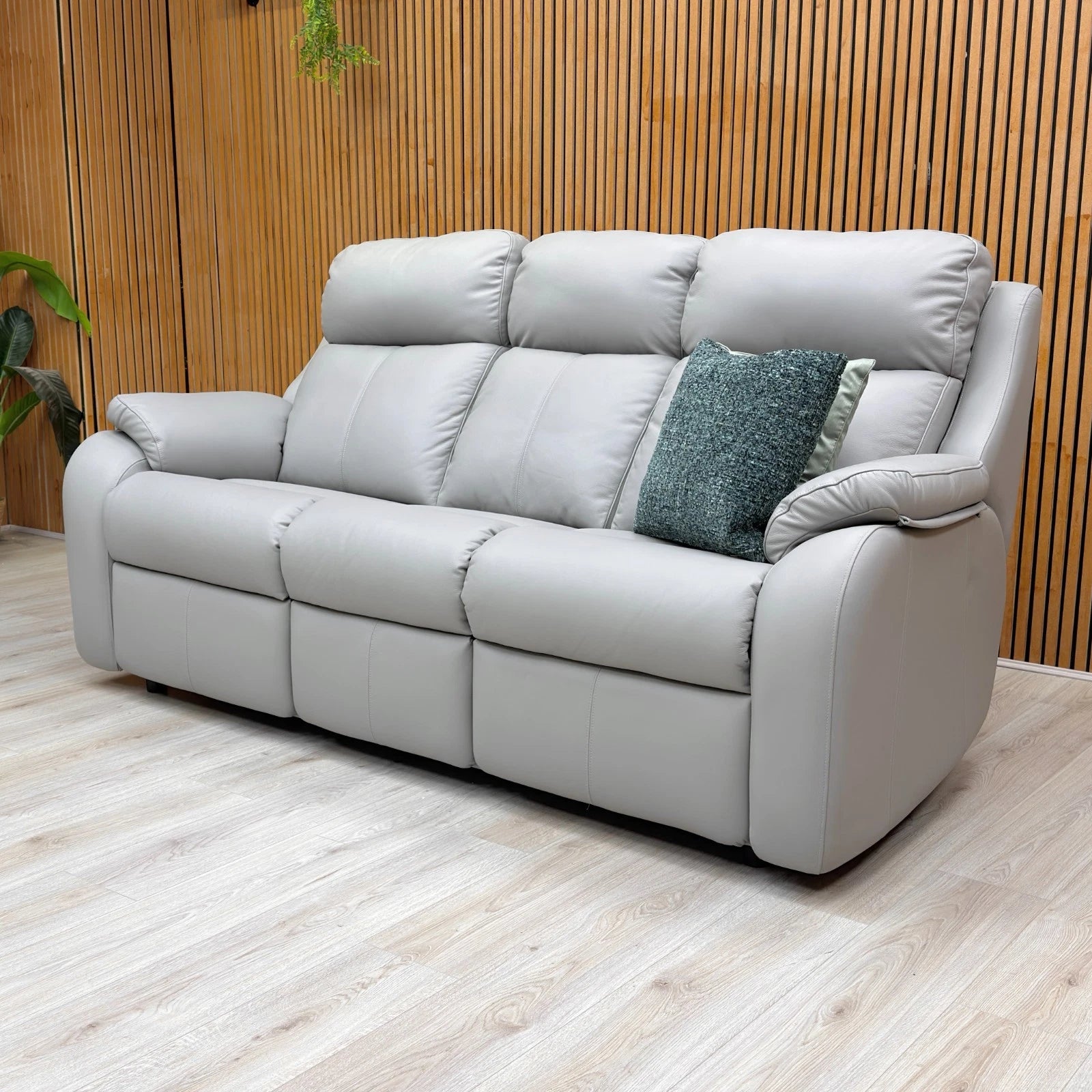 highlighting the timeless contemporary style and soft leather upholstery of the 'Kingsbury' sofa.