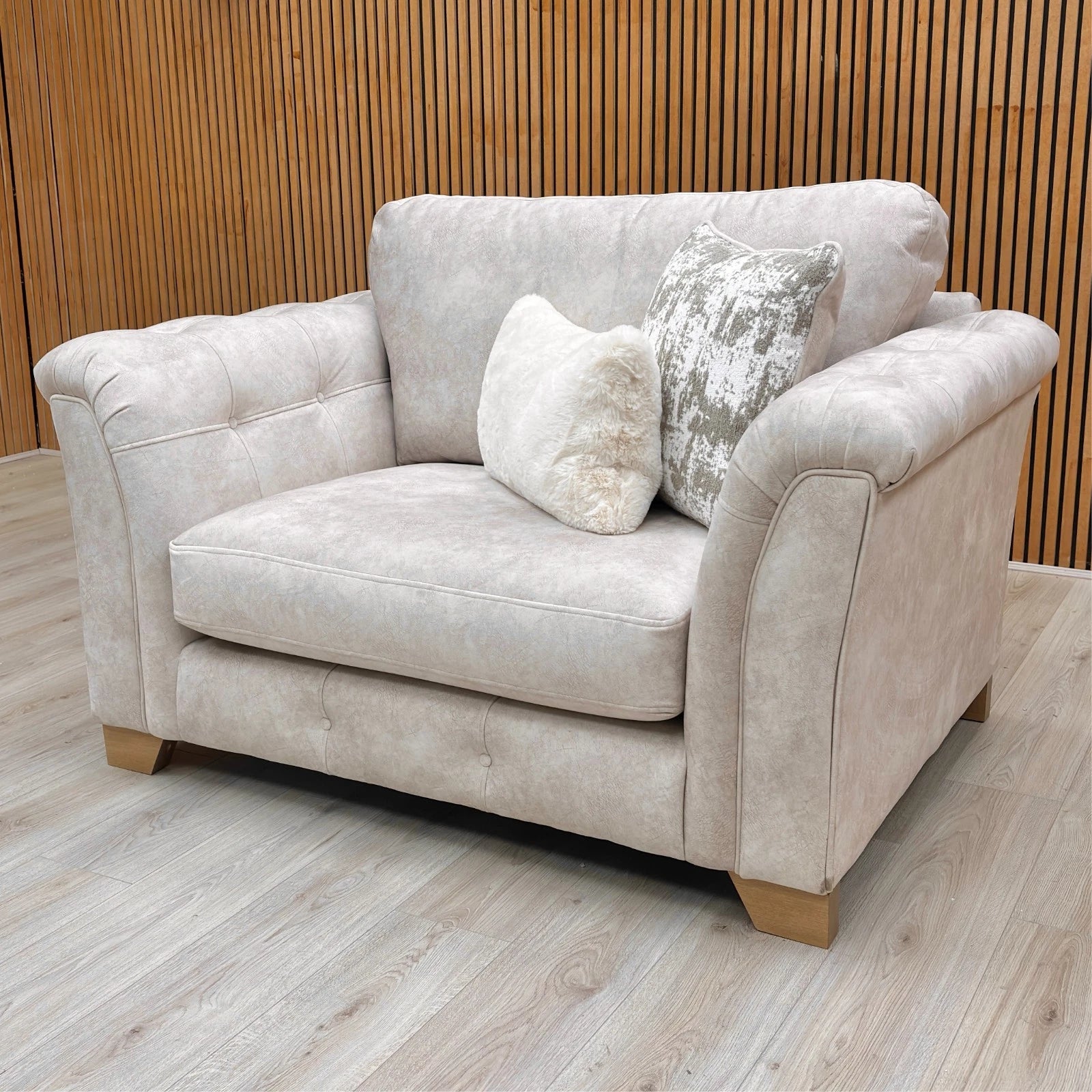 Lifestyle shot of the 'Aura' Love Chair, emphasizing its gorgeous glam style and comfort level.