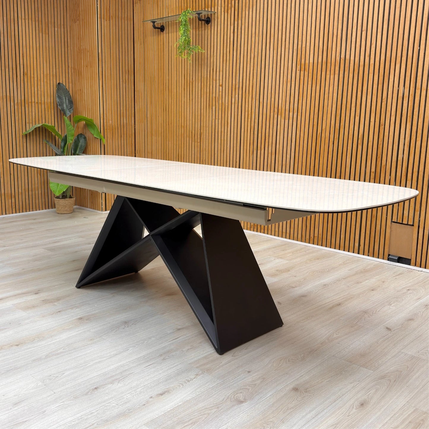 Lifestyle shot of the Oasis ceramic dining table in a contemporary dining room, highlighting its spacious 180cm rectangular design.