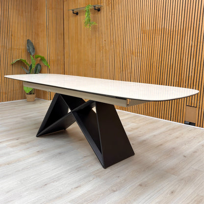 Lifestyle shot of the Oasis ceramic dining table in a contemporary dining room, highlighting its spacious 180cm rectangular design.