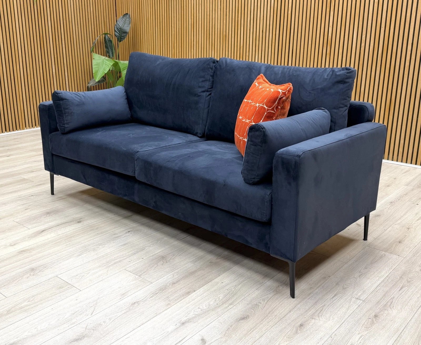 Side profile of the ‘Wren’ 3-seater sofa, showcasing the elegant sloped arm design and deep seat cushions.