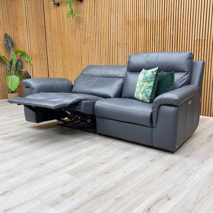 Lifestyle shot of the blue leather sofa in a contemporary living room setting.