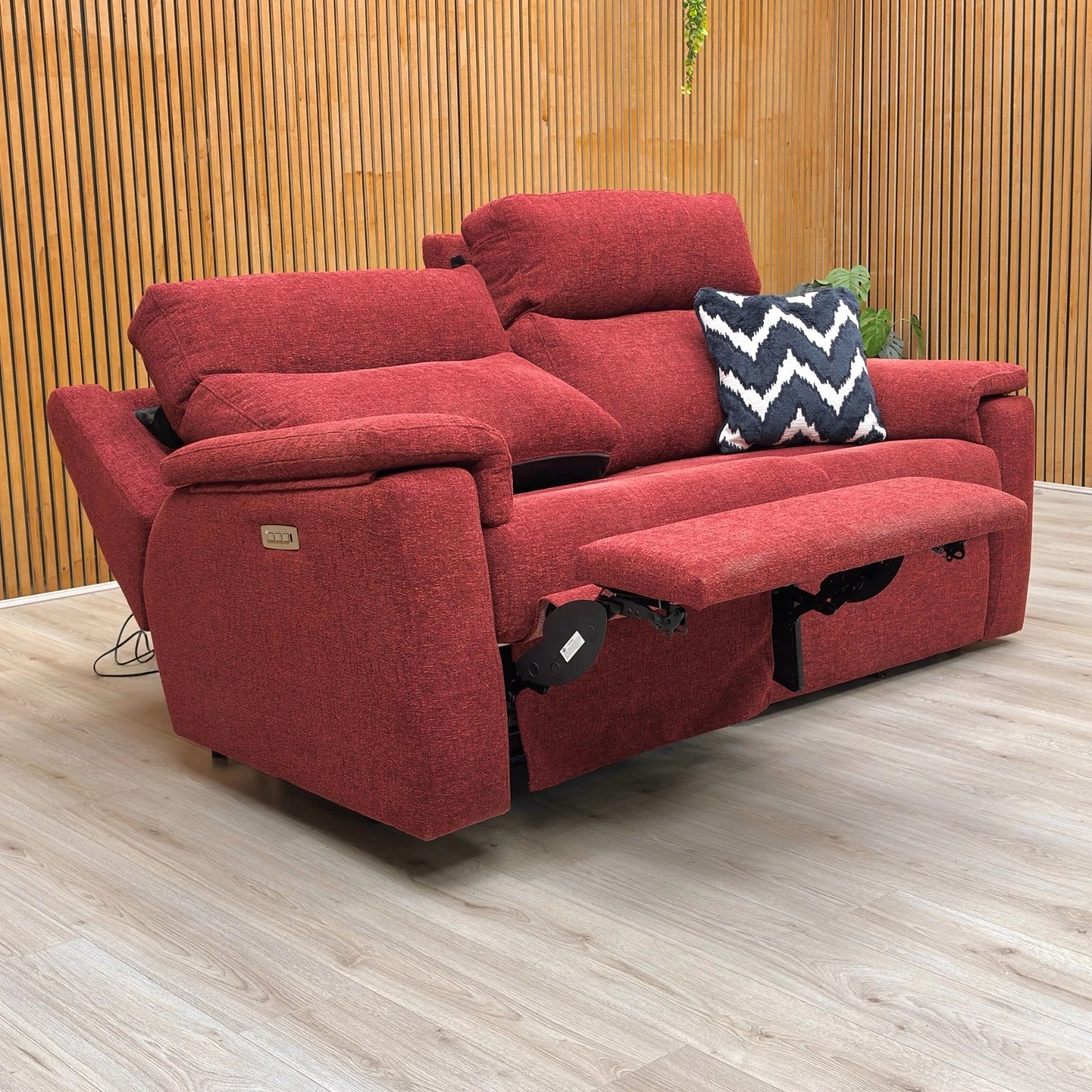 Lifestyle shot of the burgundy red G Plan Thornbury 3-seater sofa, showcasing its rich woven fabric texture and classic, supportive design.