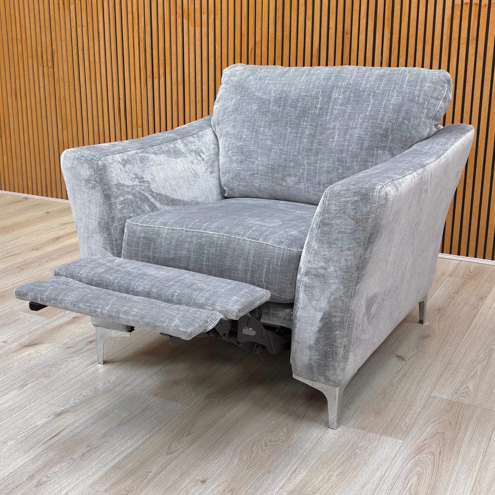 Lifestyle shot of the 'Maisy' Pebble Grey Recliner Chair in a living room.